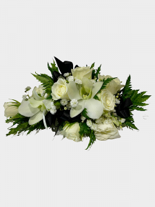 White wrist corsage with black ribbon